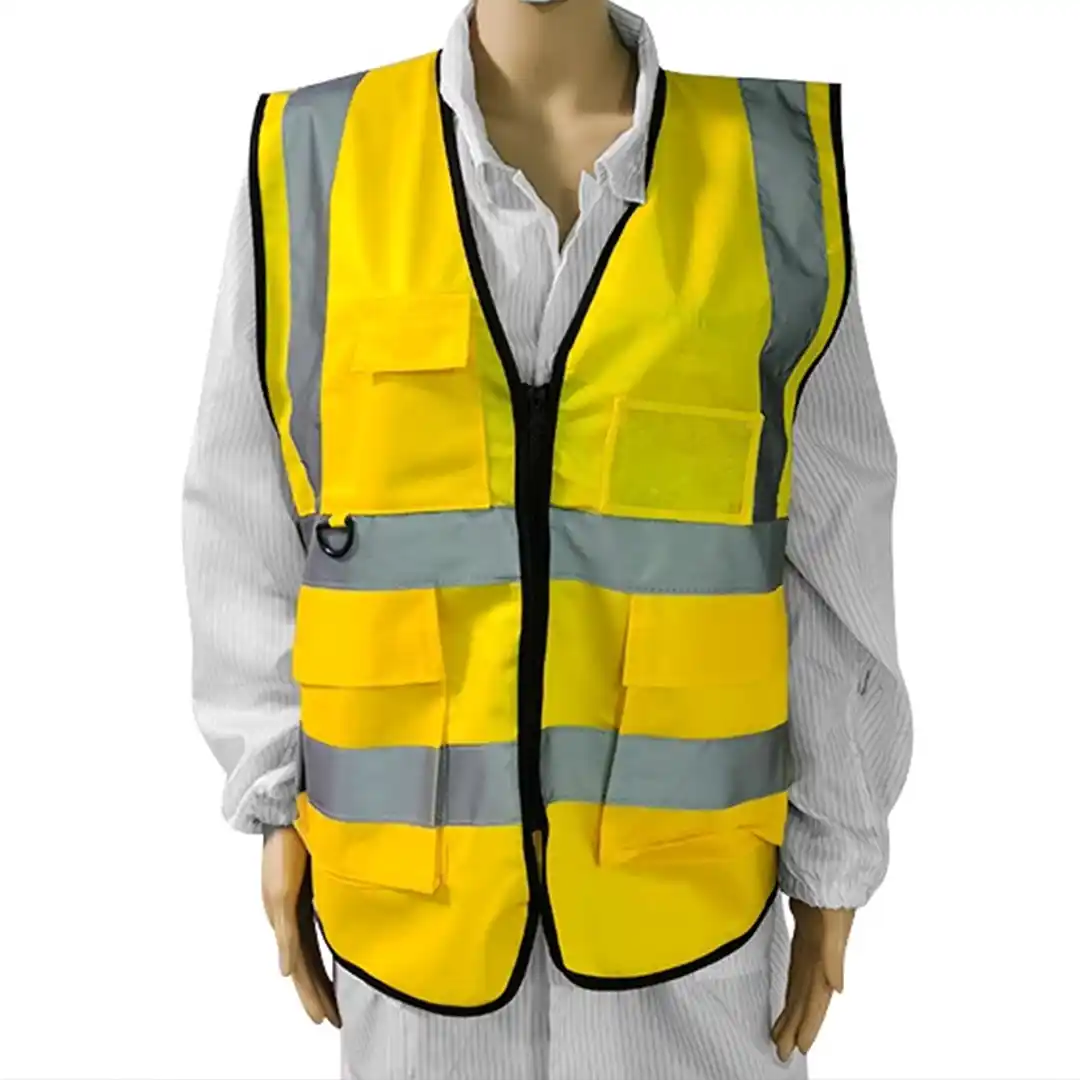 Team of workers in high visibility vests on road work project for enhanced safety.
