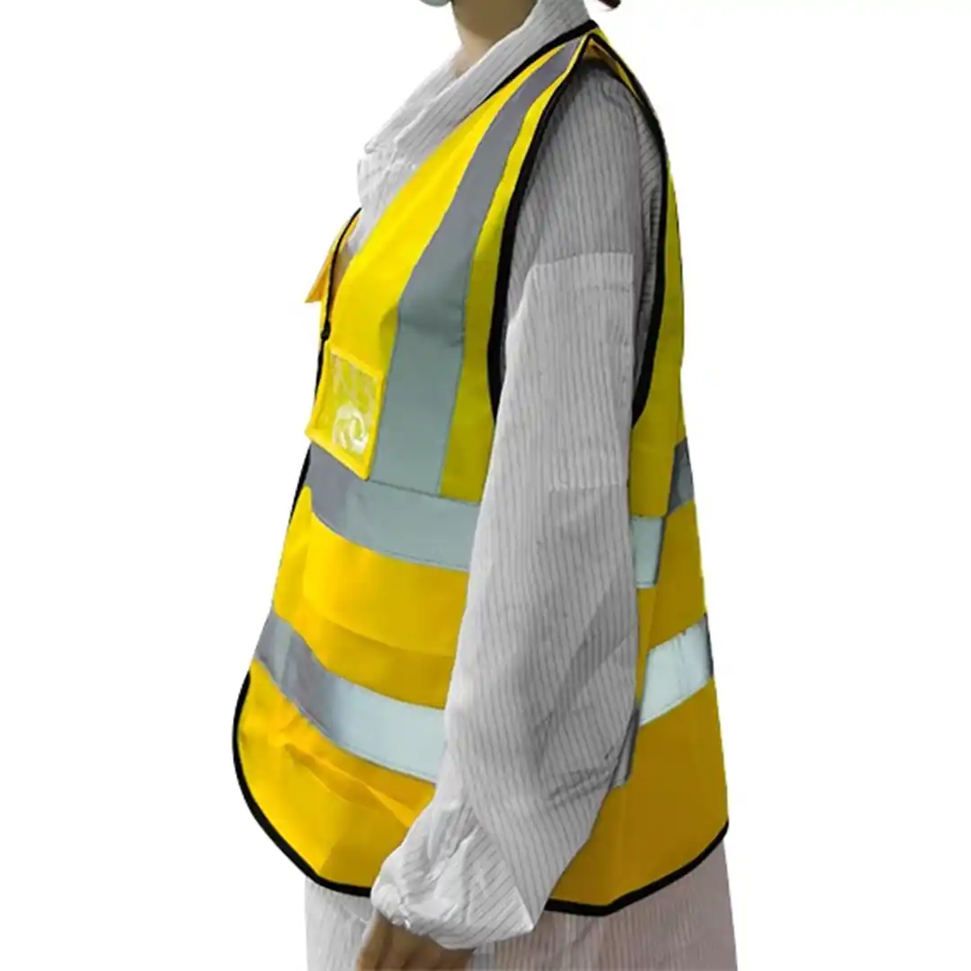 Construction worker in a yellow high visibility vest for enhanced safety on-site.